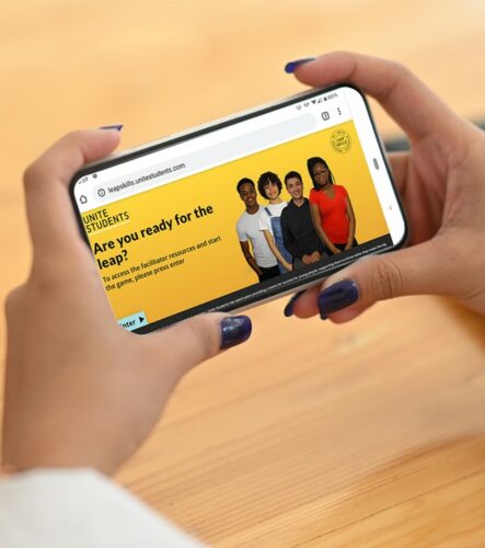 Phone being held showing Leapskills page on Unite Website